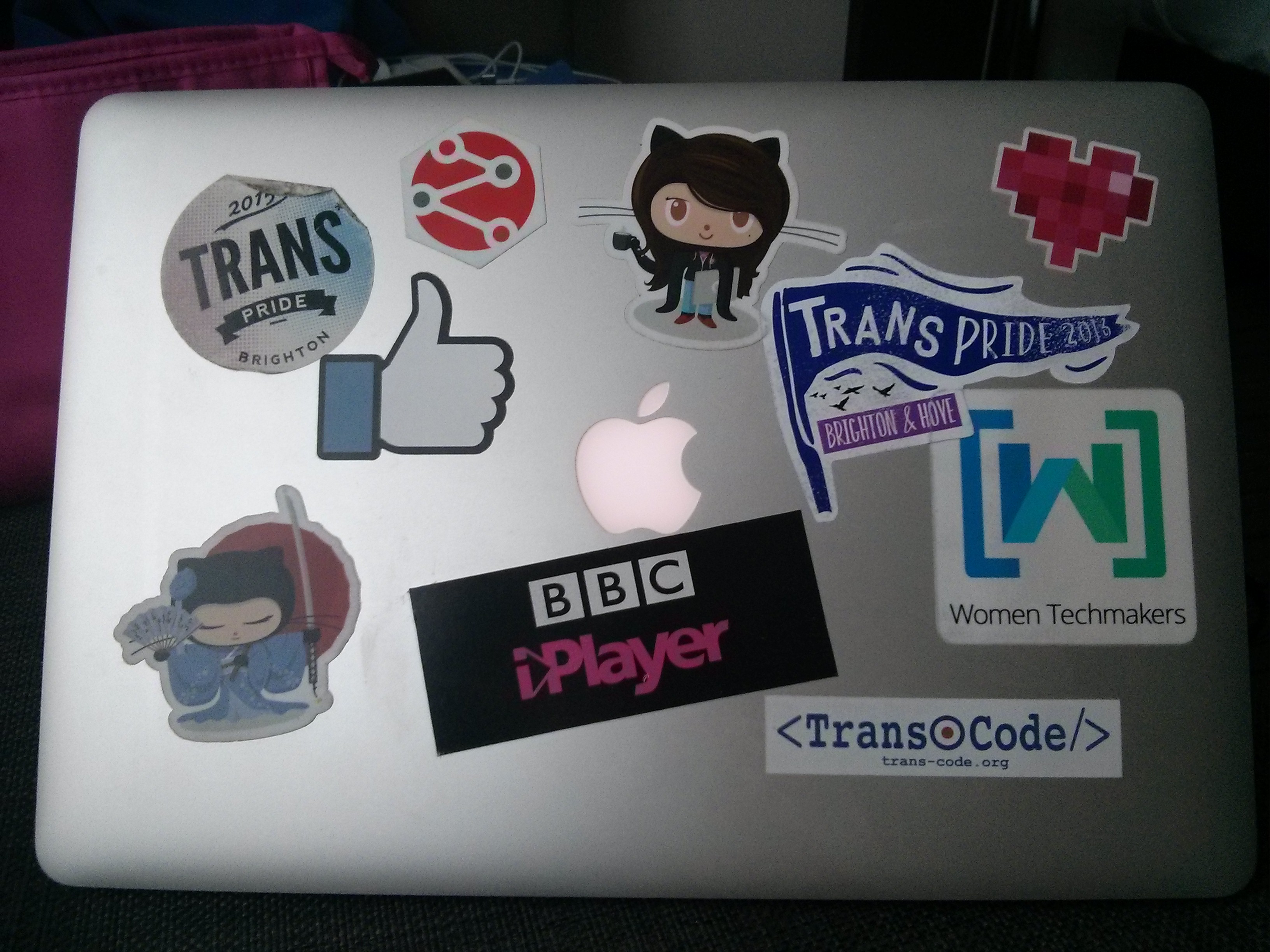 My laptop, with various stickers decorating the lid